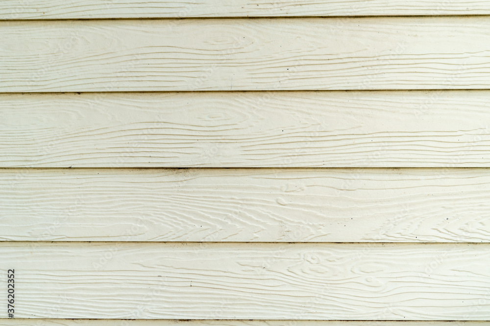 White wood background using small planks to form a wall. White wood background using small planks to form a wall.