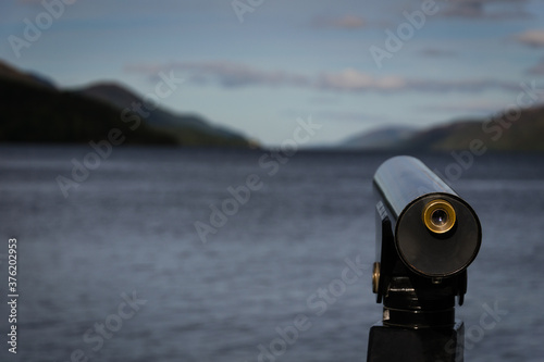Touristic telescope look at the city with view of Lake Ness, Highland, Scotland
