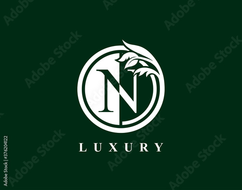 Graceful Circle N Letter Floral Logo. Luxury N Swirl Circle Logo Icon