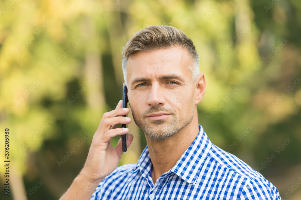 always available. cheerful man speak on cell phone. handsome businessman has groomed graying hair. mature guy is always online. agile business concept. communication with modern devices always available. cheerful man speak on cell phone. handsome businessman has groomed graying hair. mature guy is always online. agile business concept. communication with modern devices