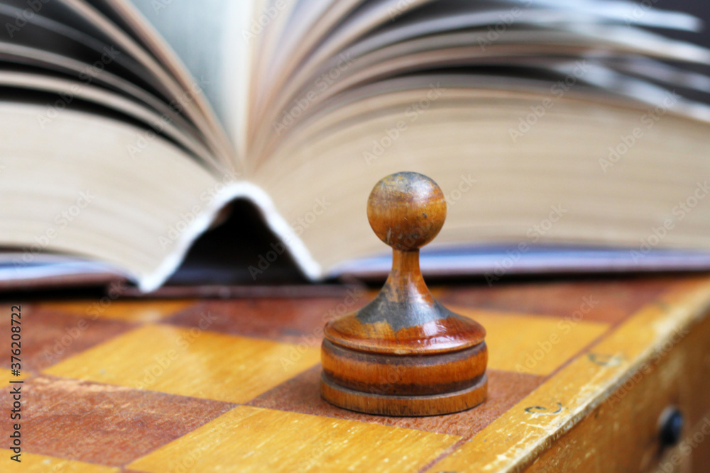Chess with book on a book background Chess with book on a book background