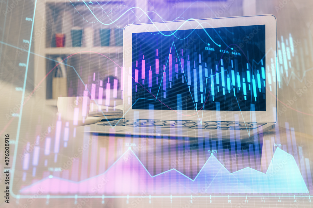 Financial market graph hologram and personal computer on background. Multi exposure. Concept of forex. Financial market graph hologram and personal computer on background. Multi exposure. Concept of forex.