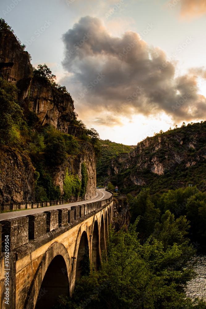 Old bridge over the river in the mountains - El Bierzo, Spain Old bridge over the river in the mountains - El Bierzo, Spain