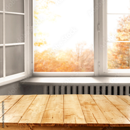 Table background of free space and autumn window 