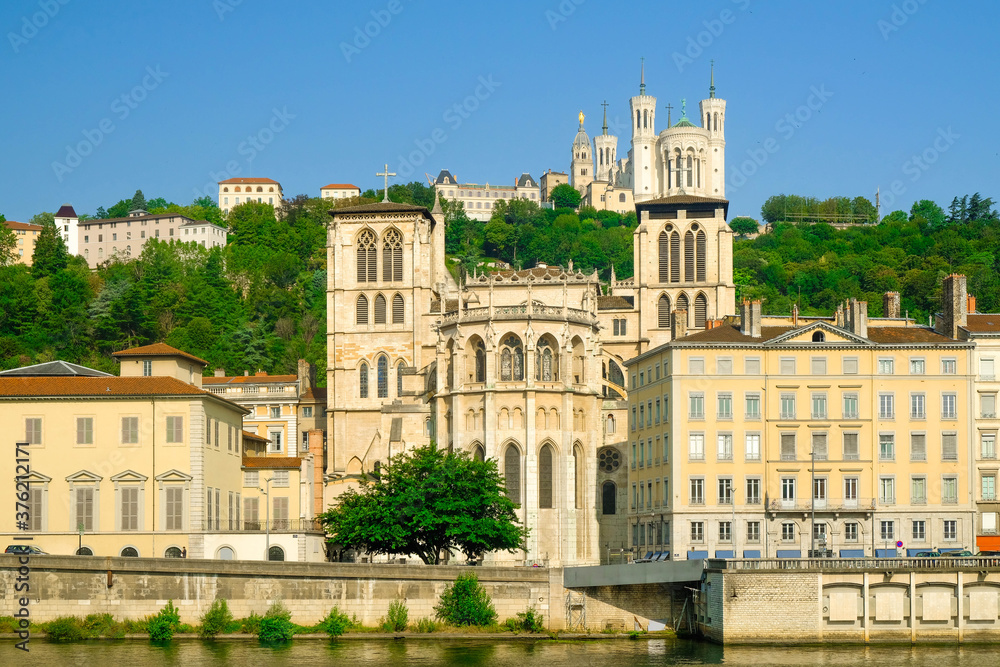 View of the Saone river embankment with Lyon Cathedral of Saint Jean Baptiste, Lyon, France