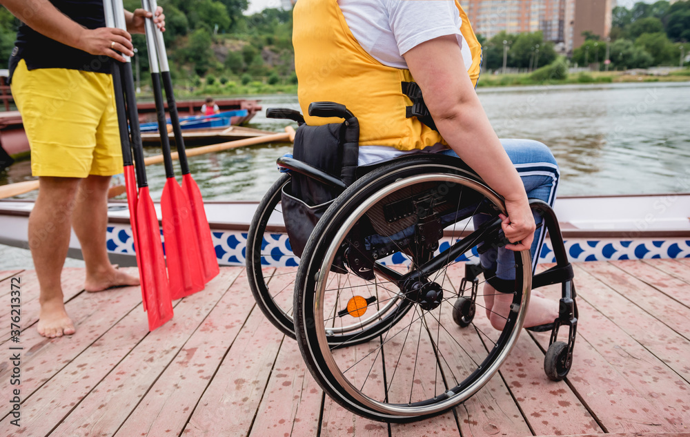 People with disabilities in life vests on the pier. People with disabilities in life vests on the pier.