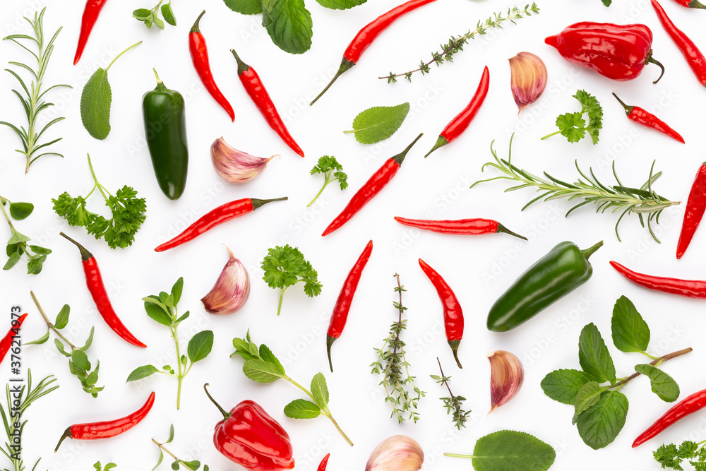 Spice herbal leaves and chili pepper on white background. Vegetables pattern. Floral and vegetables on white background. Top view, flat lay. Spice herbal leaves and chili pepper on white background. Vegetables pattern. Floral and vegetables on white background. Top view, flat lay.
