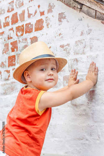 Portrait of a boy in a hat. A child poses in a beautiful hat.   © Alina Lebed