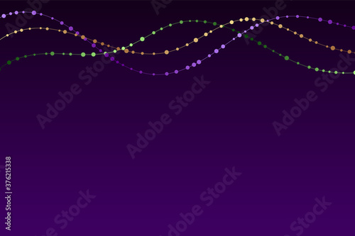 Mardi gras traditional necklaces on a dark purple background.