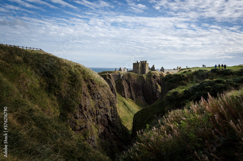 Dunnottar Castle on top of a cliff by the sea on a cloudy day  Stonehaven  Scotland  United Kingdom