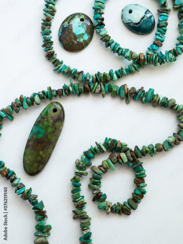 Natural turquoise of different sizes on a white background Natural turquoise of different sizes on a white background