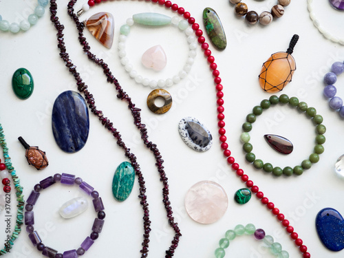 Multicolored semi-precious stones on a white background