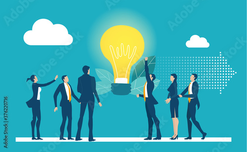 Team of business people stand around light bulb and generating new ideas and way to success.  Working together for success. 