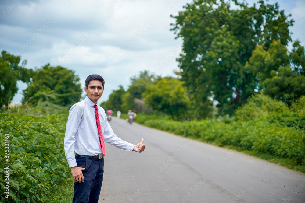 Young asian / Indian boy Standing on the road Young asian / Indian boy Standing on the road
