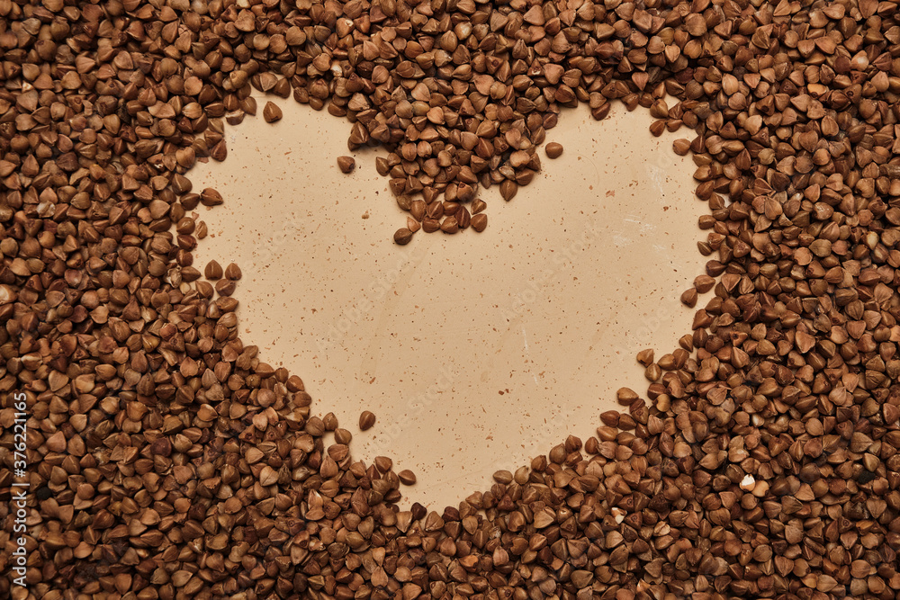 buckwheat on a backdrop. rustic buckwheat background. buckwheat heart sign. buckwheat on a backdrop. rustic buckwheat background. buckwheat heart sign.