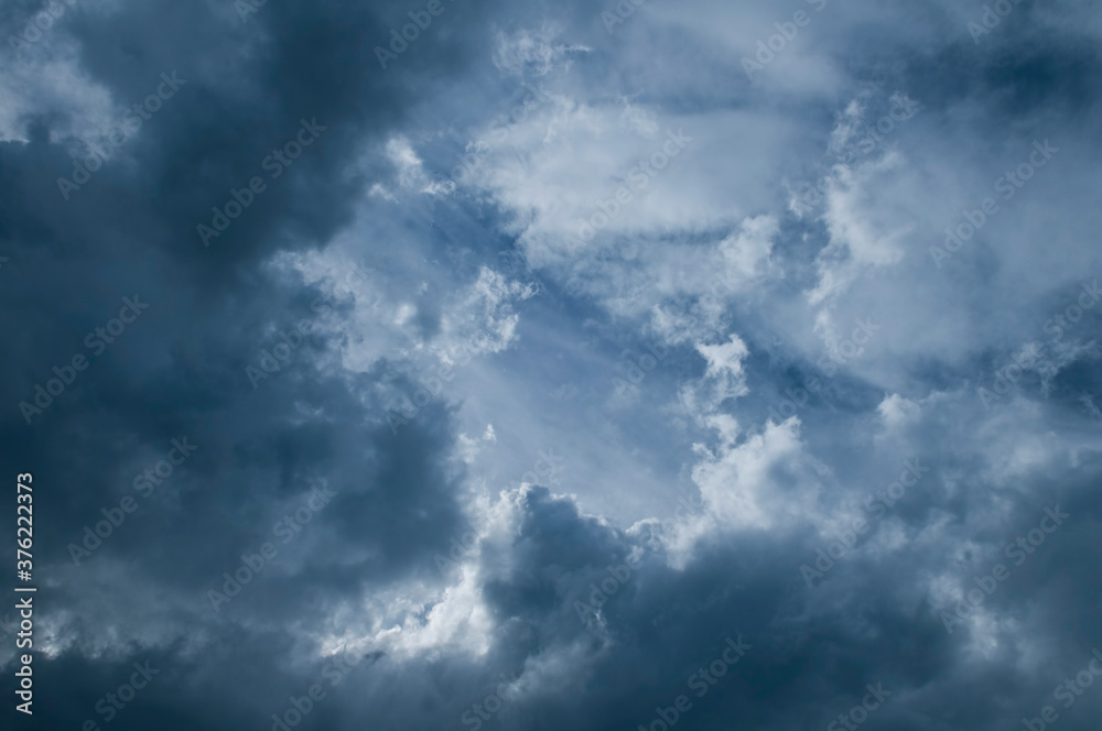 Dramatic dark blue sky with heavy clouds background. Dramatic dark blue sky with heavy clouds background.