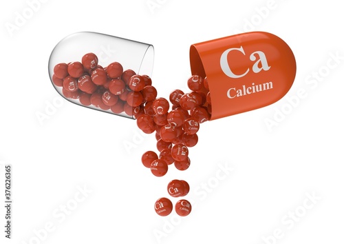 Open capsule with calcium from which the vitamin composition is pouring