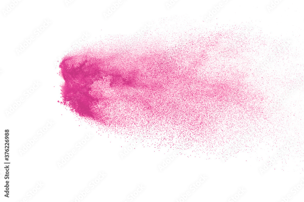 Freeze motion of pink color powder exploding on white  background. 