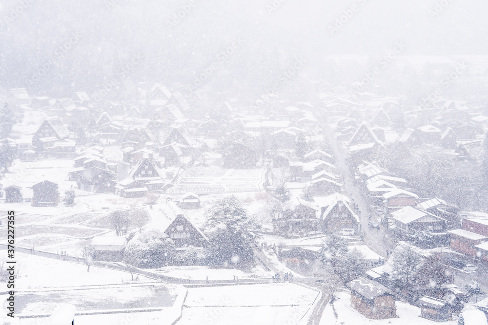 Gassho-zukuri houses on Shirakawago villages with snowfall in Gokayama Village from hill view point in snowing fall winter. Shirakawa-go has been inscribed on UNESCO World Heritage, Gifu Prefecture