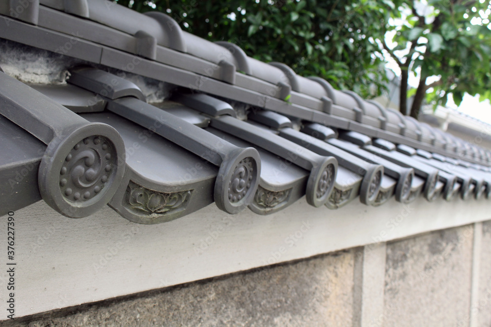 Roof tile of Nakamachi Catholic Church in Nagasaki, representing Trinity? Roof tile of Nakamachi Catholic Church in Nagasaki, representing Trinity?