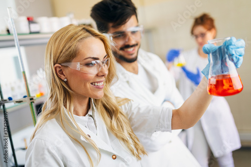 Group of medical scientists working at the laboratory. Research virus people concept