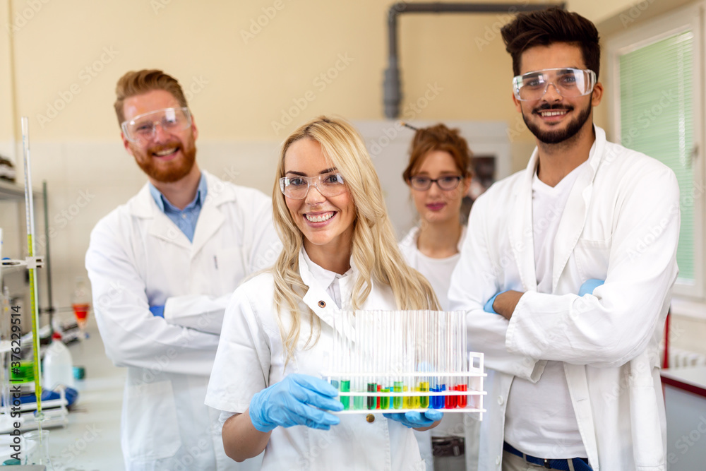 Group of medical scientists working at the laboratory. Research virus people concept Group of medical scientists working at the laboratory. Research virus people concept