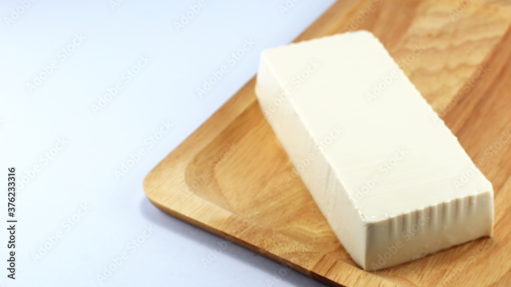 White tofu on a wooden tray