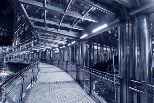 Night scene of empty modern pedestrian walkway in downtown
