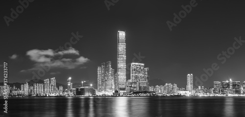 Panorama of skyline of Victoria harbor of Hong Kong city at night © leeyiutung