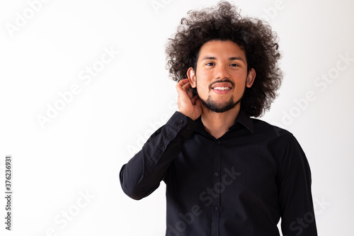 Latin american model, happy expression, neutral background 