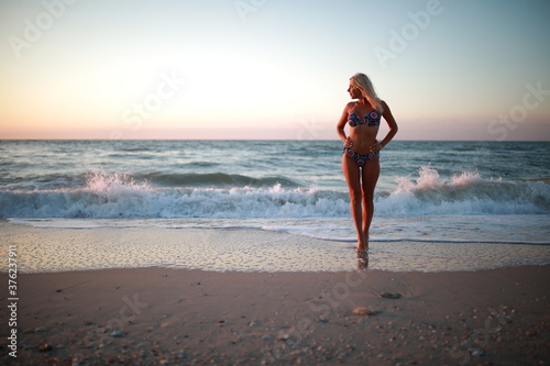 young woman running on the beach