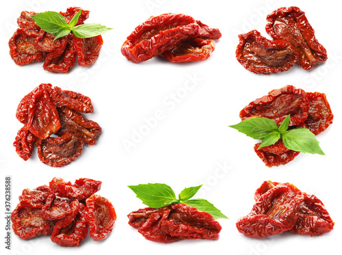 Frame of tasty sun dried tomatoes on white background photo