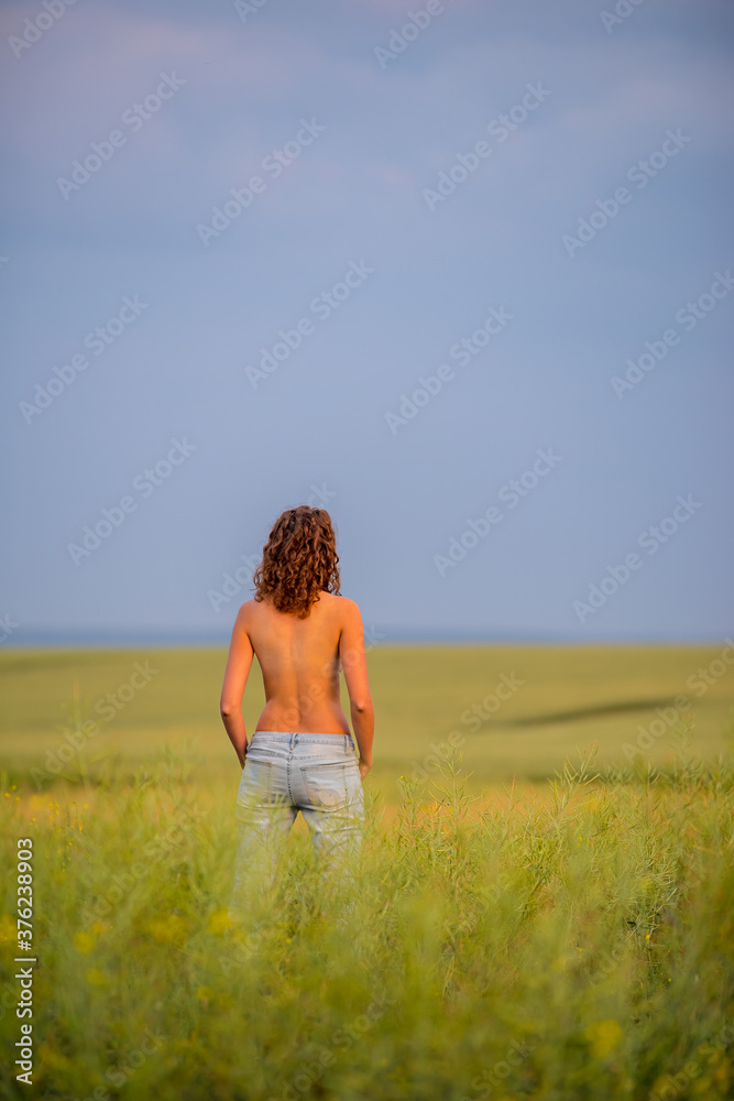 naked girl in a field of wheat