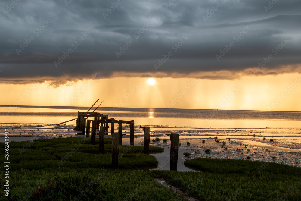 Old jetty on the shoreline of Snettisham beach