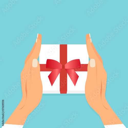 vector of two female hands holding gift box with red ribbon.