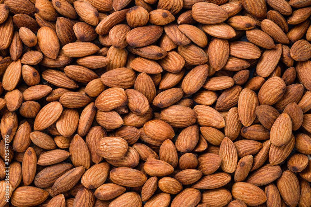 Top view of fresh raw peeled almonds nut for background. Top view of fresh raw peeled almonds nut for background.