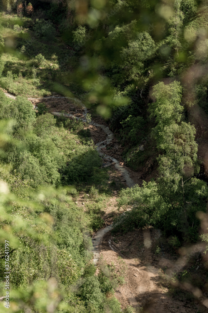 mountain landscape with deep gorge. mountains, green pass. Picturesque scenery with beautiful hills and rocks. Colorful view to unusual relief. Caucasus mountain mountain landscape with deep gorge. mountains, green pass. Picturesque scenery with beautiful hills and rocks. Colorful view to unusual relief. Caucasus mountain