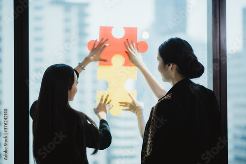 Concept of idea and creative jigsaw puzzle for the business partner team support and work together photo