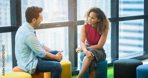 Bild auf Leinwand A couple of two business part talking and consulting at the co-working space