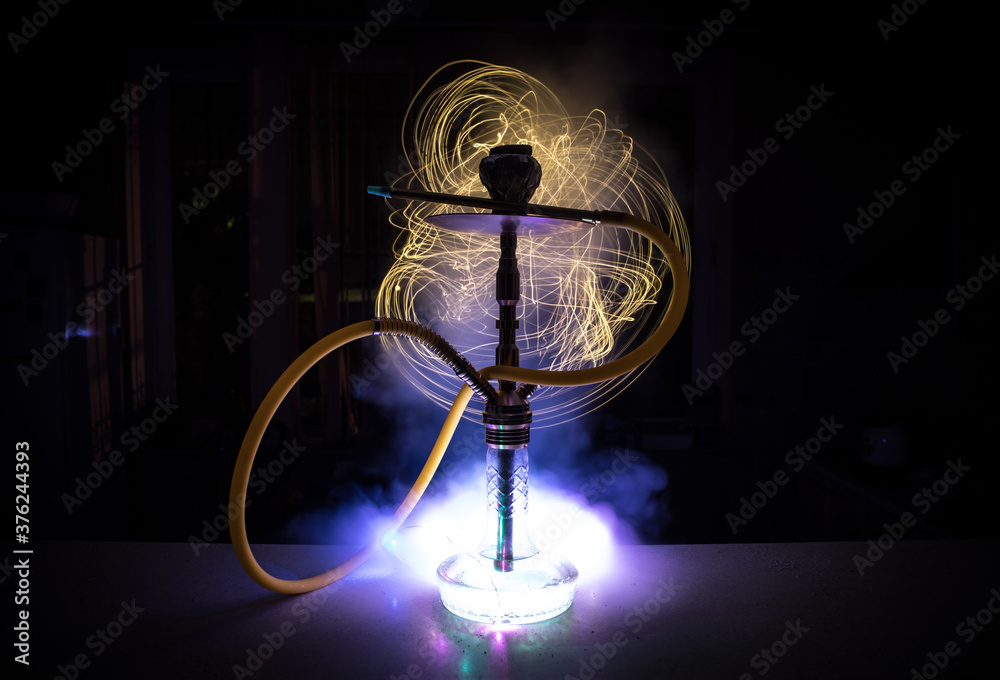Hookah hot coals on shisha bowl with black background. Stylish oriental shisha. Shisha Concept Hookah hot coals on shisha bowl with black background. Stylish oriental shisha. Shisha Concept