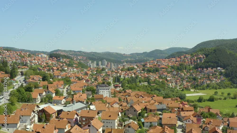 Aerial shot Uzice Serbia. Drone video of the city with houses in which red roofs can be seen streets, east, landscape, mountains. Aerial shot Uzice Serbia. Drone video of the city with houses in which red roofs can be seen streets, east, landscape, mountains.