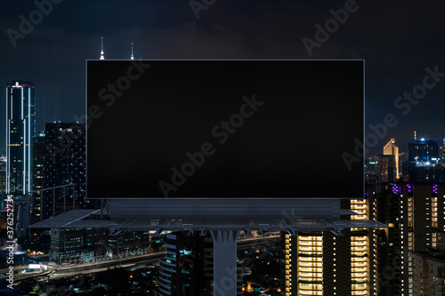 Canvas Print Blank black road billboard with Kuala Lumpur cityscape background at night time