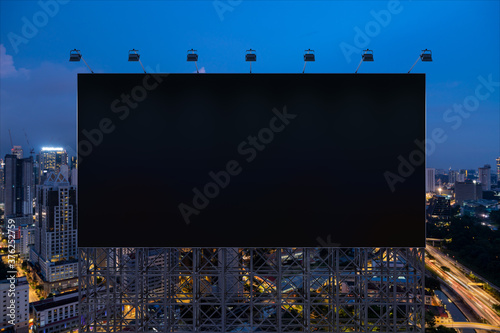 Photography Blank black road billboard with Kuala Lumpur cityscape background at night time
