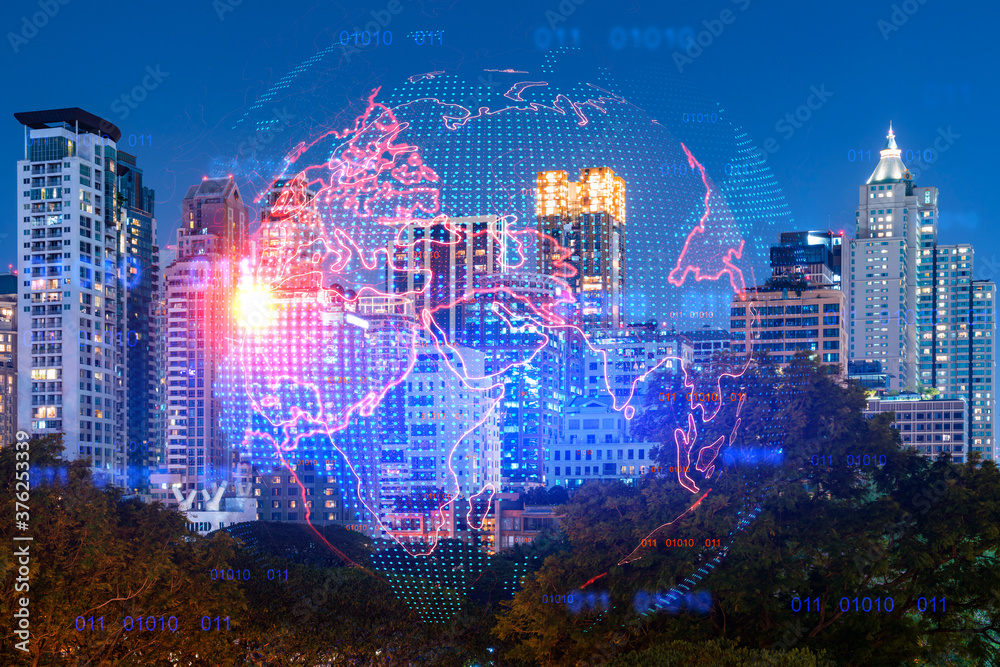 Fototapeta premium Hologram of Earth planet map on night panoramic cityscape of Bangkok, Asia. The concept of international companies. Multi Exposure.