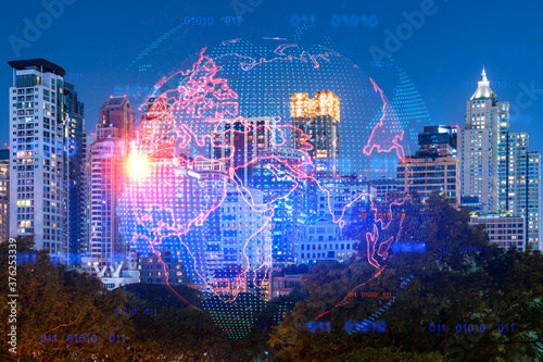 Hologram of Earth planet map on night panoramic cityscape of Bangkok, Asia. The concept of international companies. Multi Exposure. © VideoFlow
