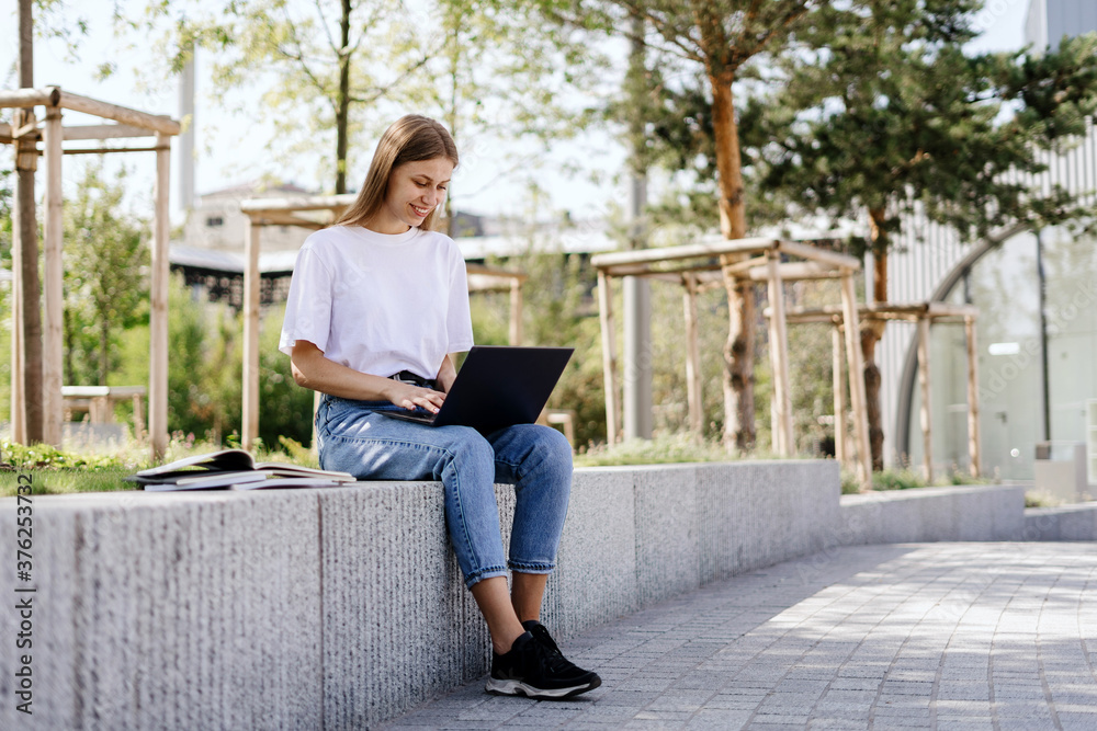 Young student girl using modern laptop computer Young student girl using modern laptop computer