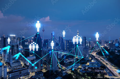 Photography Glowing Social media icons on night panoramic city view of Kuala Lumpur, Malaysia, Asia