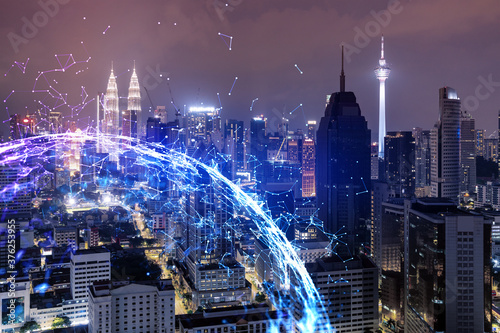Photography Abstract technology icons, night aerial panoramic cityscape of Kuala Lumpur, Malaysia, Asia