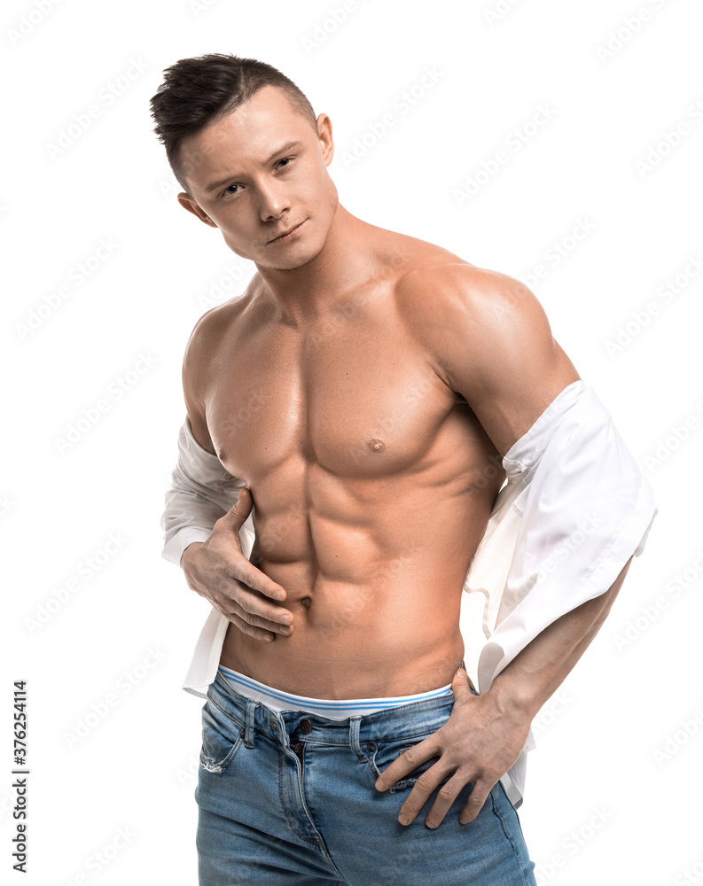Portrait of a sexy young man in a blue jeans - isolated on white background. Portrait of a sexy young man in a blue jeans - isolated on white background.
