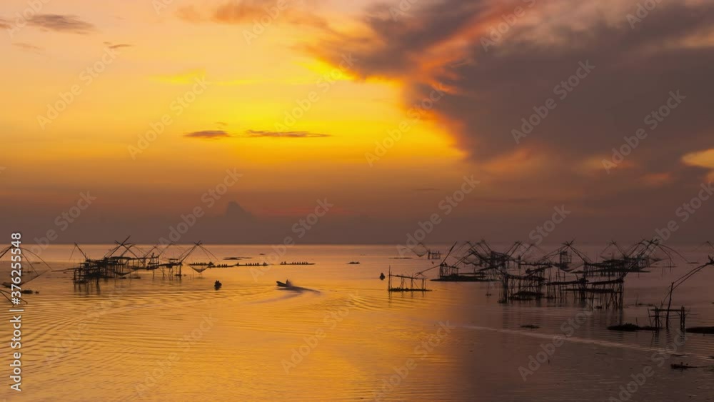 4K time lapse view of pakpra fisherman village and traditional fishing net made by bamboo in sea with tourism boat sightseeing in morning located in Phatthalung province Thailand
4K time lapse view of pakpra fisherman village and traditional fishing net made by bamboo in sea with tourism boat sightseeing in morning located in Phatthalung province Thailand